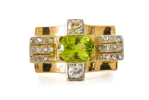 A PERIDOT AND DIAMOND RING