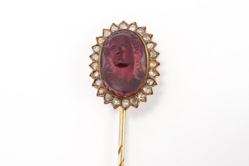 A GARNET AND DIAMOND STICK PIN