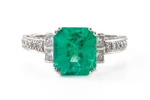 AN EMERALD AND DIAMOND RING