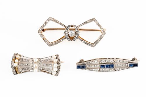 THREE DIAMOND BROOCHES