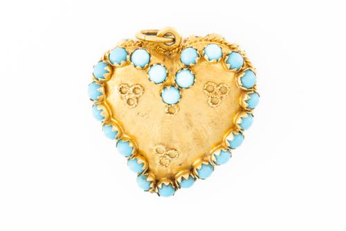 A TURQUOISE SET HEART PENDANT
