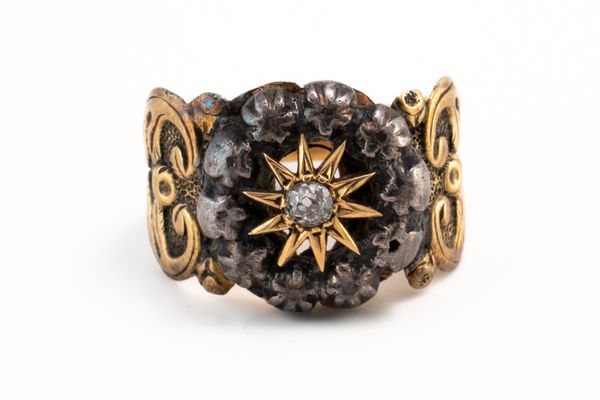 AN ANTIQUE DIAMOND STAR MOTIF RING