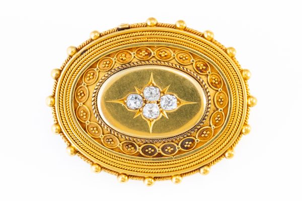 A VICTORIAN GOLD AND DIAMOND LOCKET BROOCH