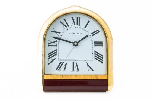 A CARTIER PARIS GILT METAL TRAVELLING ALARM CLOCK