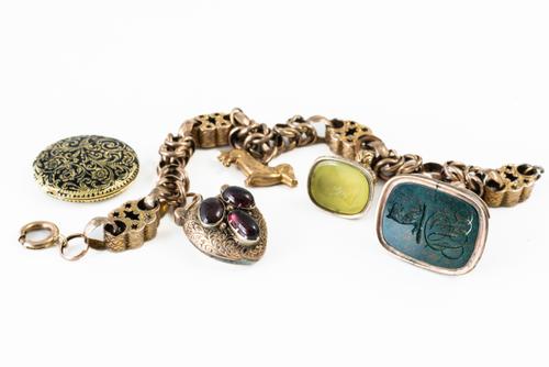 AN ANTIQUE CHARM BRACELET AND A LOCKET (2)
