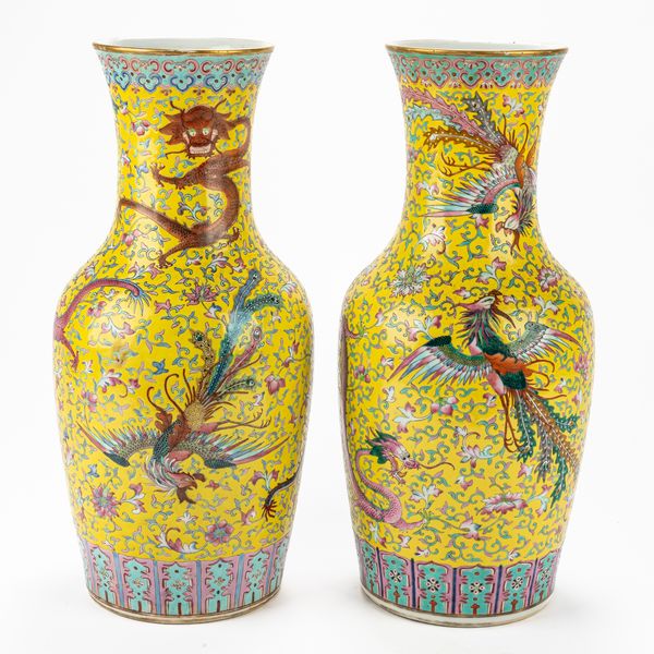 A PAIR OF CHINESE BALUSTER YELLOW-GROUND FAMILLE-ROSE `DRAGON AND PHOENIX' VASES