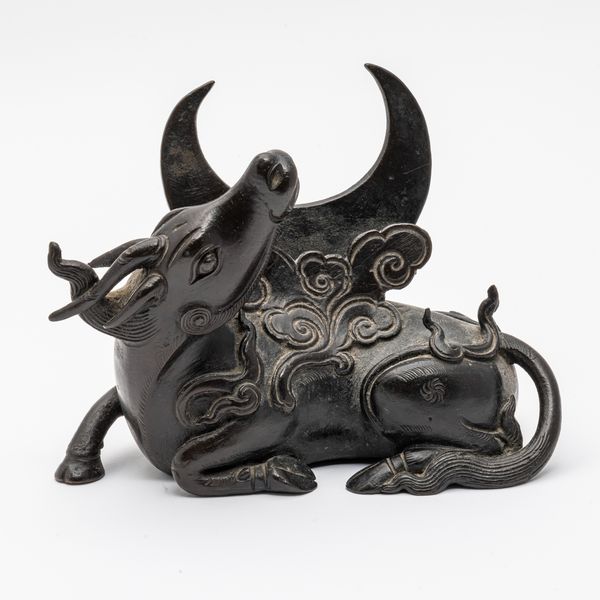 A CHINESE BRONZE QILIN-FORM MIRROR STAND