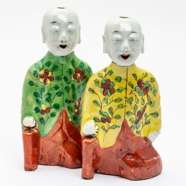 TWO CHINESE PORCELAIN FIGURES OF KNEELING BOYS (2)