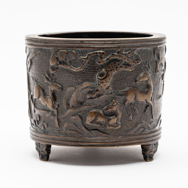 A CHINESE BRONZE TRIPOD CENSER