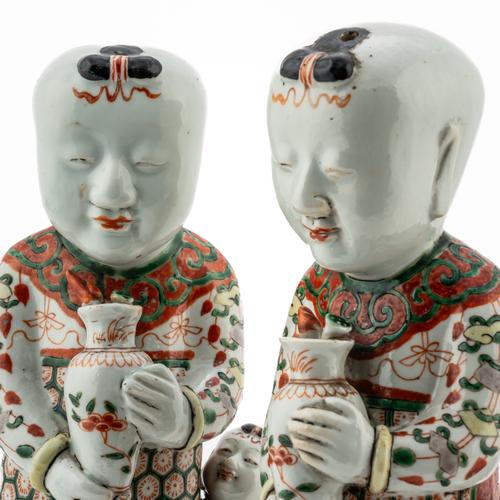 TWO SIMILAR CHINESE FAMILLE-VERTE FIGURES OF BOYS (2)
