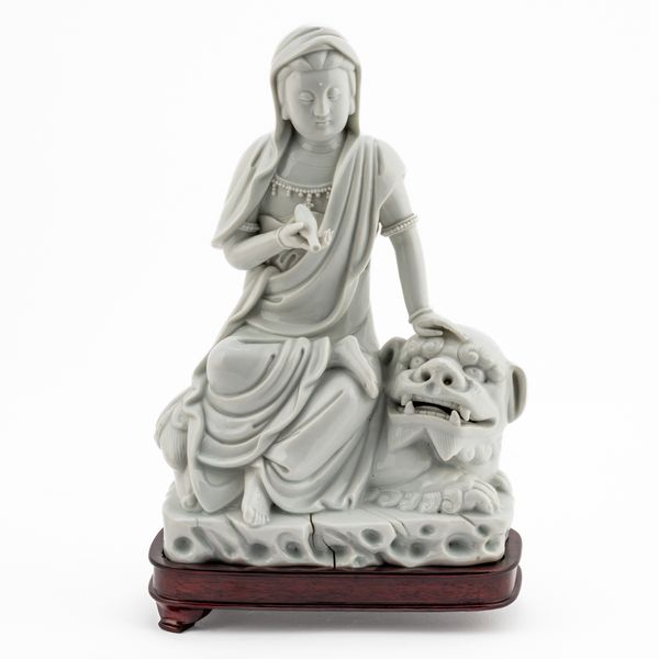 A CHINESE BLANC DE CHINE GROUP OF GUANYIN AND A LION (3)