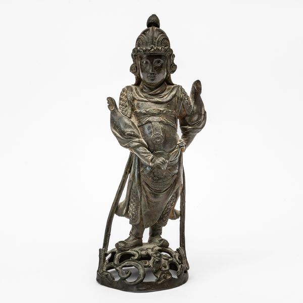 A CHINESE BRONZE FIGURE OF A GUARDIAN