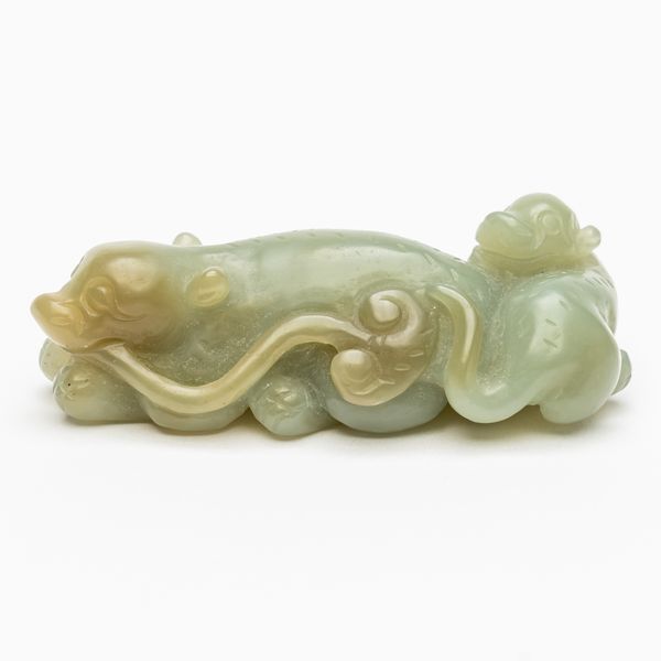 A CHINESE CEALDON JADE CARVING OF A RECUMBENT CAT WITH KITTEN