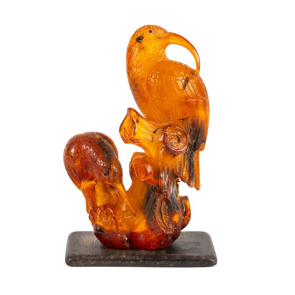 A CHINESE RECONSTITUTED AMBER GROUP OF TWO WADING BIRDS (2)