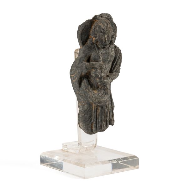 A SMALL GANDHARAN GREY SCHIST TORSO OF BODHISATTVA MAITREYA