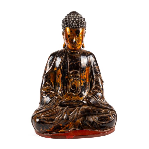 A VIETNAMESE CARVED WOOD GILT AND LACQUERED FIGURE OF GAUTAMA BUDDHA