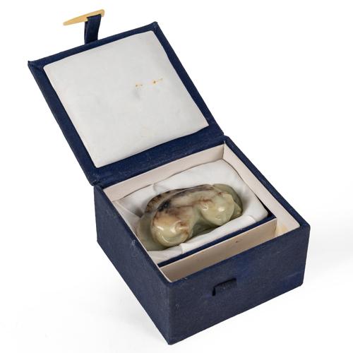 A CHINESE CELADON AND BROWN JADE 'CAT' CARVING (2)