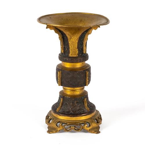 A CHINESE PARCEL GILT BRONZE GU VESSEL
