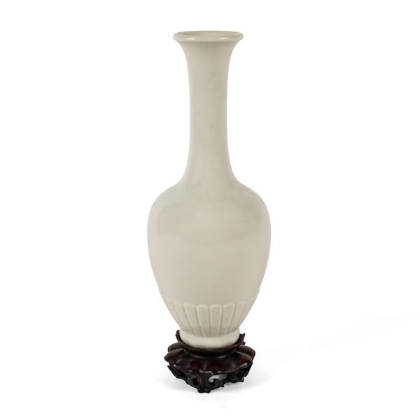 A CHINESE WHITE-GLAZED PORCELAIN BOTTLE FORM VASE (2)