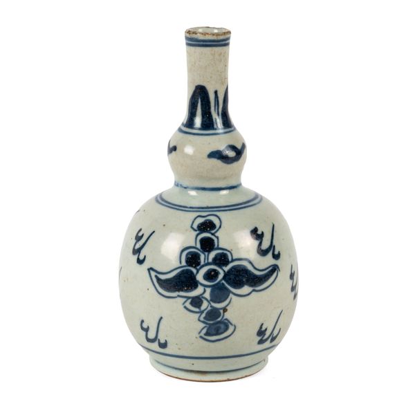 A CHINESE PROVINCIAL BLUE AND WHITE PORCELAIN DOUBLE GOURD FORM BOTTLE VASE