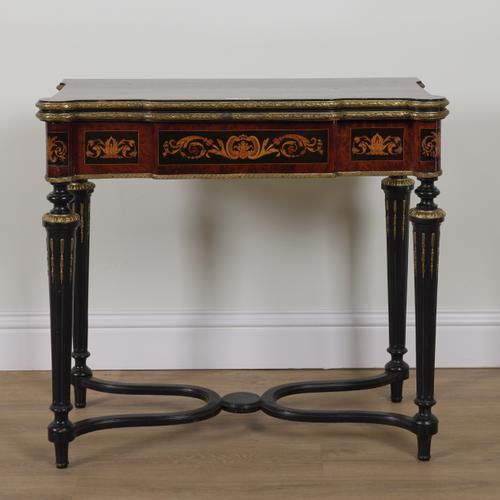 A LATE 19TH CENTURY MARQUETRY INLAID GILT METAL MOUNTED EBONISED AND AMBOYNA FOLD OVER CARD TABLE