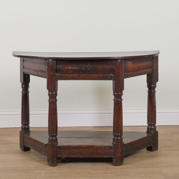 A 17TH CENTURY OAK DEMI-LUNE CREDENCE TABLE