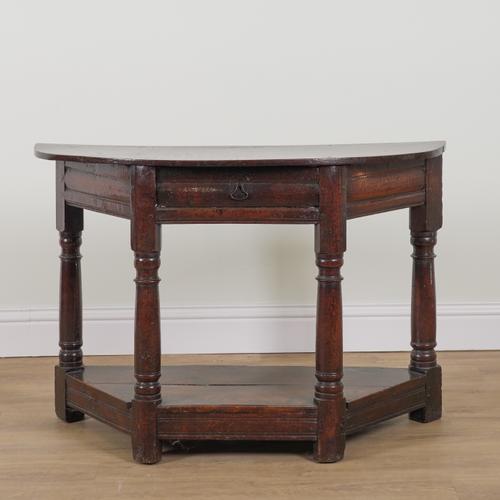 A 17TH CENTURY OAK DEMI-LUNE CREDENCE TABLE