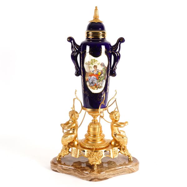 A LOUIS XVI STYLE GILT-METAL MOUNTED SEVRES STYLE CERAMIC CENTRE-PIECE