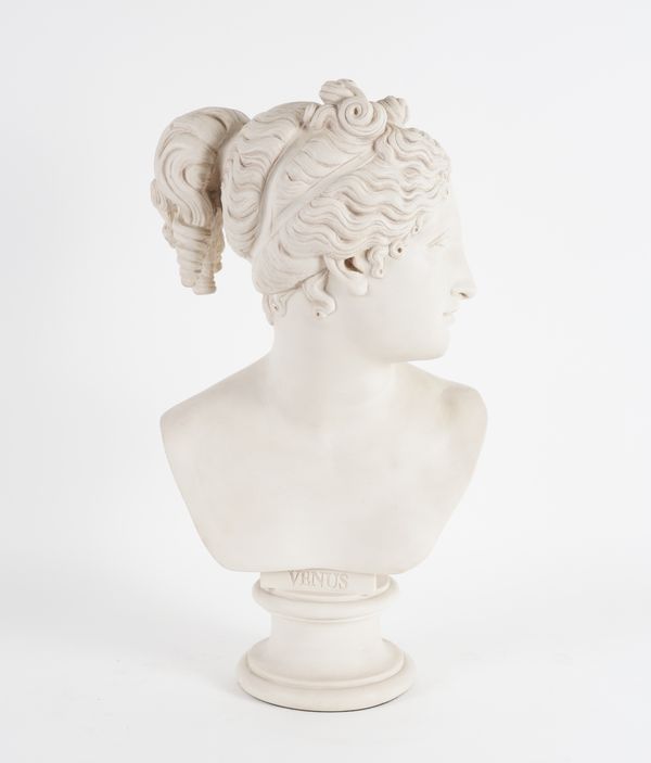 ANTHONY REDMILE: A WHITE COMPOSITE FAUX MARBLE BUST OF THE GODDESS VENUS, AFTER THE ANTIQUE