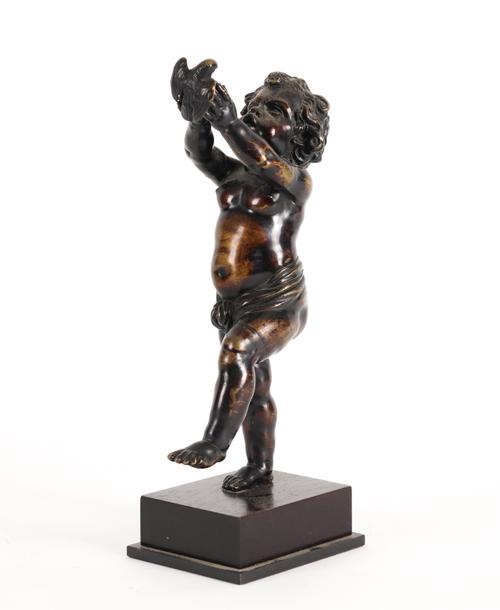 IN THE MANNER OF CLAUDE MICHEALE CLODION (FRENCH, 1738-1814): A FRENCH BRONZE MODEL OF A PUTTO HOLDING A DOVE