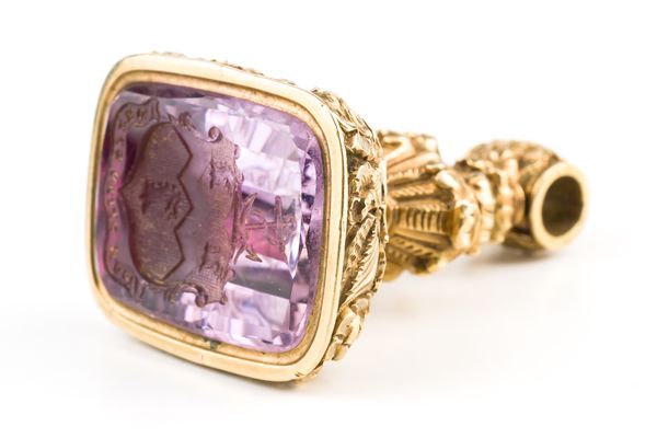 A MID 19TH CENTURY GOLD CASED AND FOIL BACKED AMETHYST PENDANT FOB SEAL