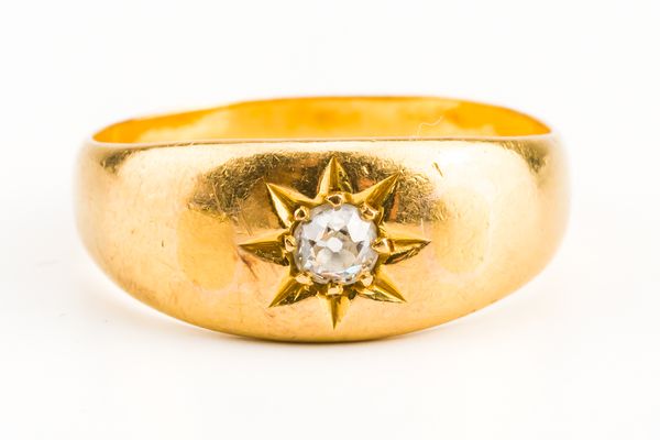 A GOLD AND DIAMOND SINGLE STONE RING