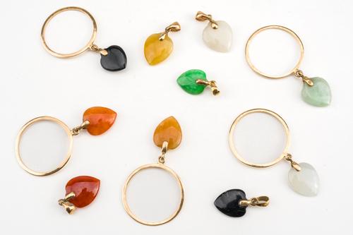 A GROUP OF TEN HARDSTONE HEART SHAPED PENDANTS (10)