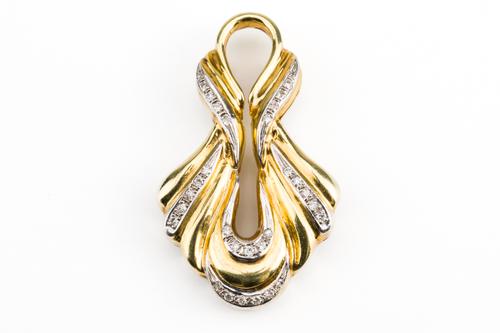 A GOLD AND DIAMOND PENDANT