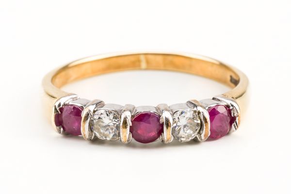 A 9CT GOLD RUBY AND DIAMOND FIVE STONE RING