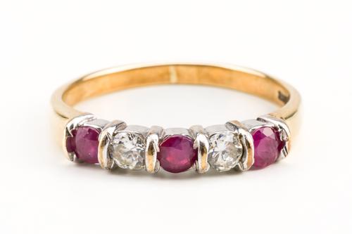 A 9CT GOLD RUBY AND DIAMOND FIVE STONE RING