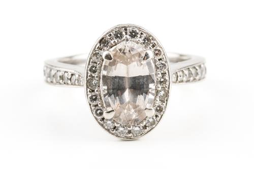 A SAPPHIRE AND DIAMOND RING