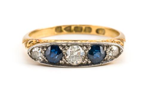 AN 18CT GOLD SAPPHIRE AND DIAMOND FIVE STONE RING