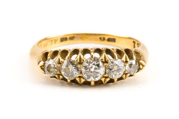 A GOLD AND DIAMOND FIVE STONE RING