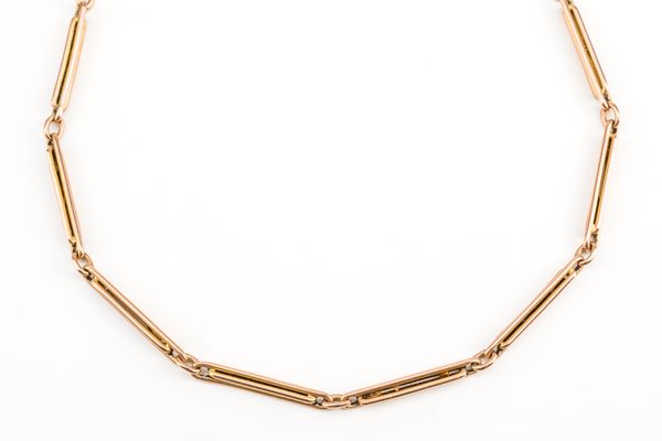 A GOLD TWIN BAR AND OVAL LINK CHAIN