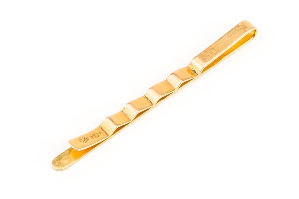 AN ITALIAN GOLD TIE SLIDE