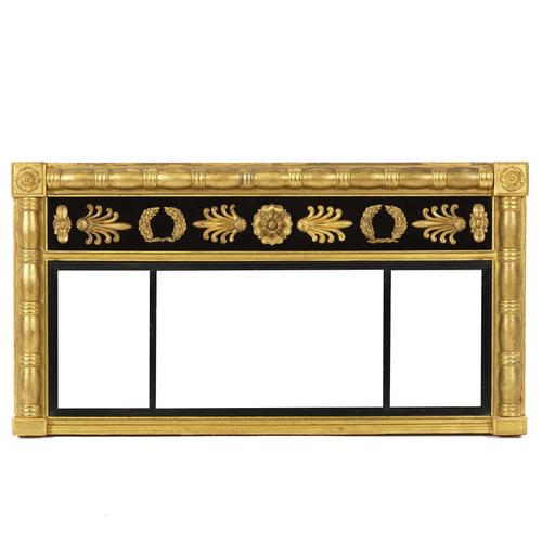 A REGENCY GILT FRAMED AND EBONISED TRIPLE PLATE OVERMANTEL MIRROR