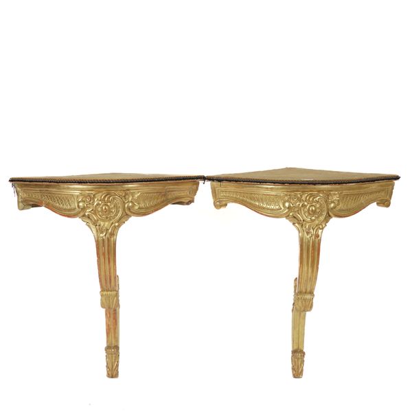 A PAIR OF 19TH CENTURY GILT FRAMED CORNER CONSOLE TABLES (2)