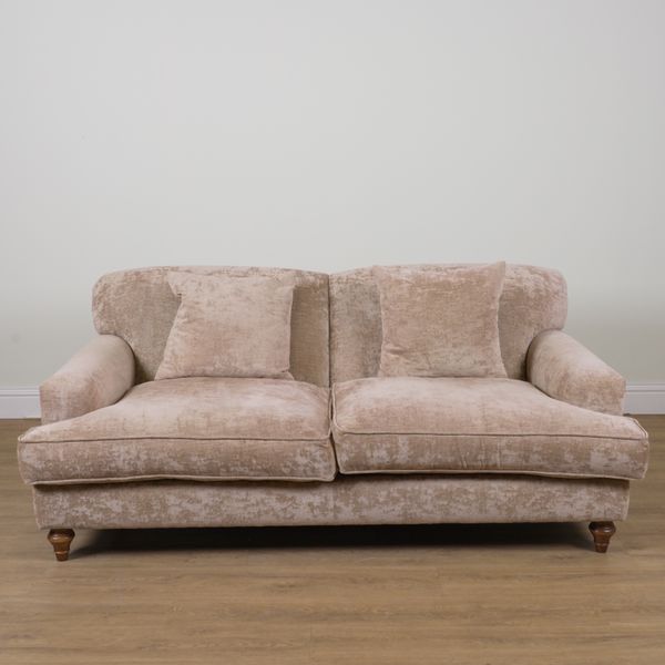 A MODERN BEIGE UPHOLSTERED SOFA