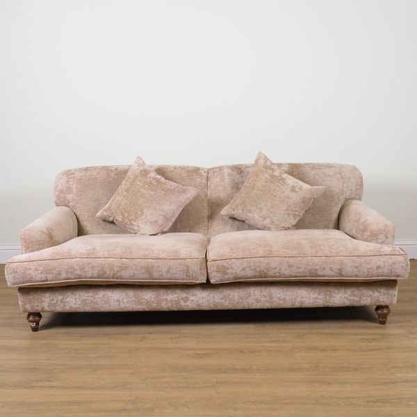 A MODERN BEIGE UPHOLSTERED SOFA