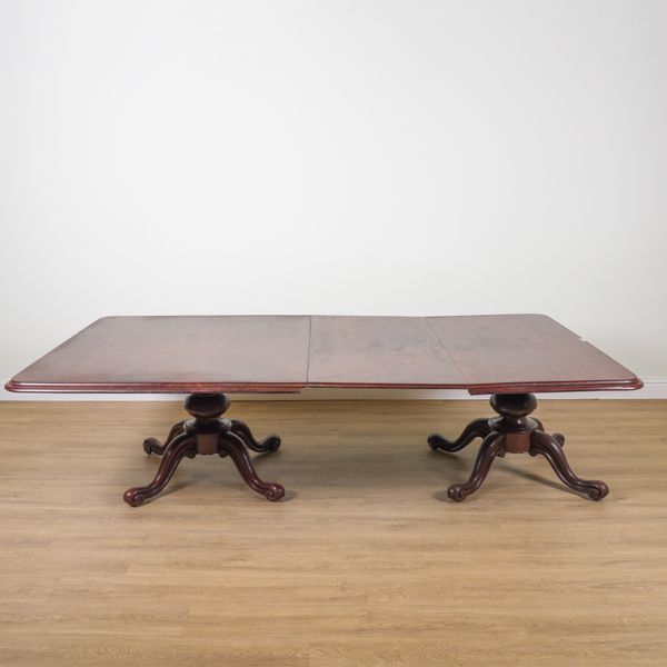 AN 19TH CENTURY MAHOGANY TWIN PEDESTAL EXTENDING DINING TABLE