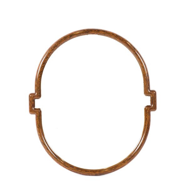 ROBERT INGHAM; A WENGE SHAPED OVAL WALL MIRROR