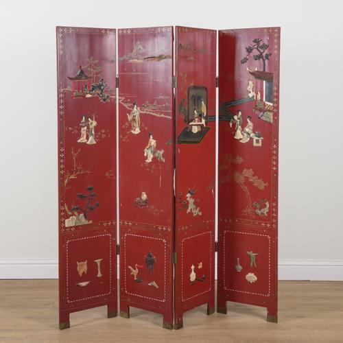 AN EARLY 20TH CENTURY JAPANESE RED LAQUARED AND HARD STONE MOUNTED FOUR FOLD SCREEN