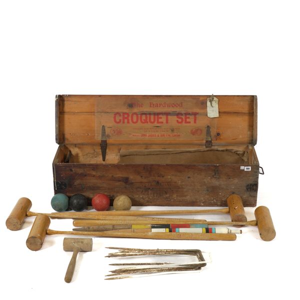 JOHN JAQUES: A CASED HARDWOOD CROQUET SET