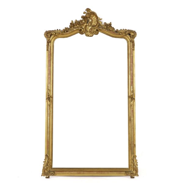 A LATE 19TH CENTURY GILT FRAMED ARCH TOPPED WALL MIRROR